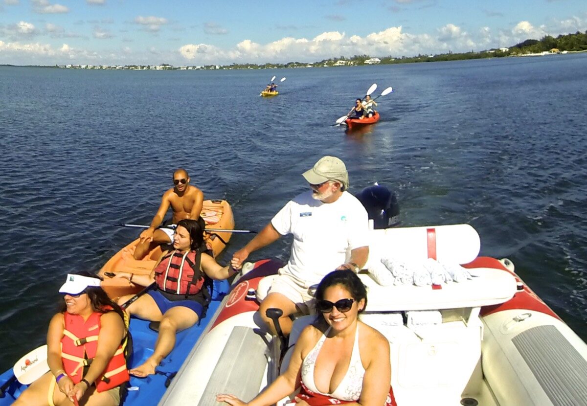A Caribbean Watersports guide leading guests on a private kayak and bay tour in Key Largo