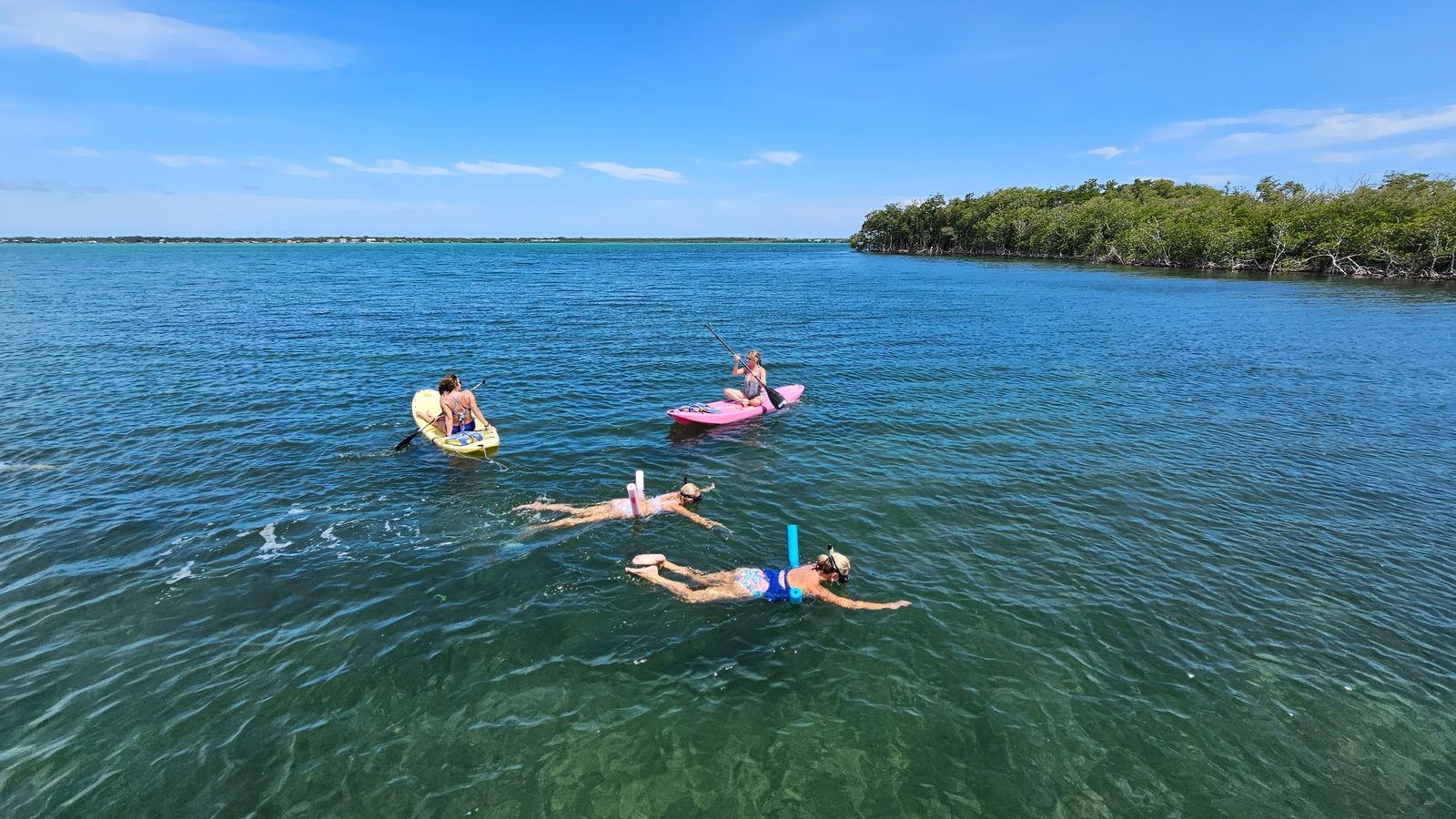 Calm, shallow turquoise water ideal for kids learning to snorkel near Pelican Key