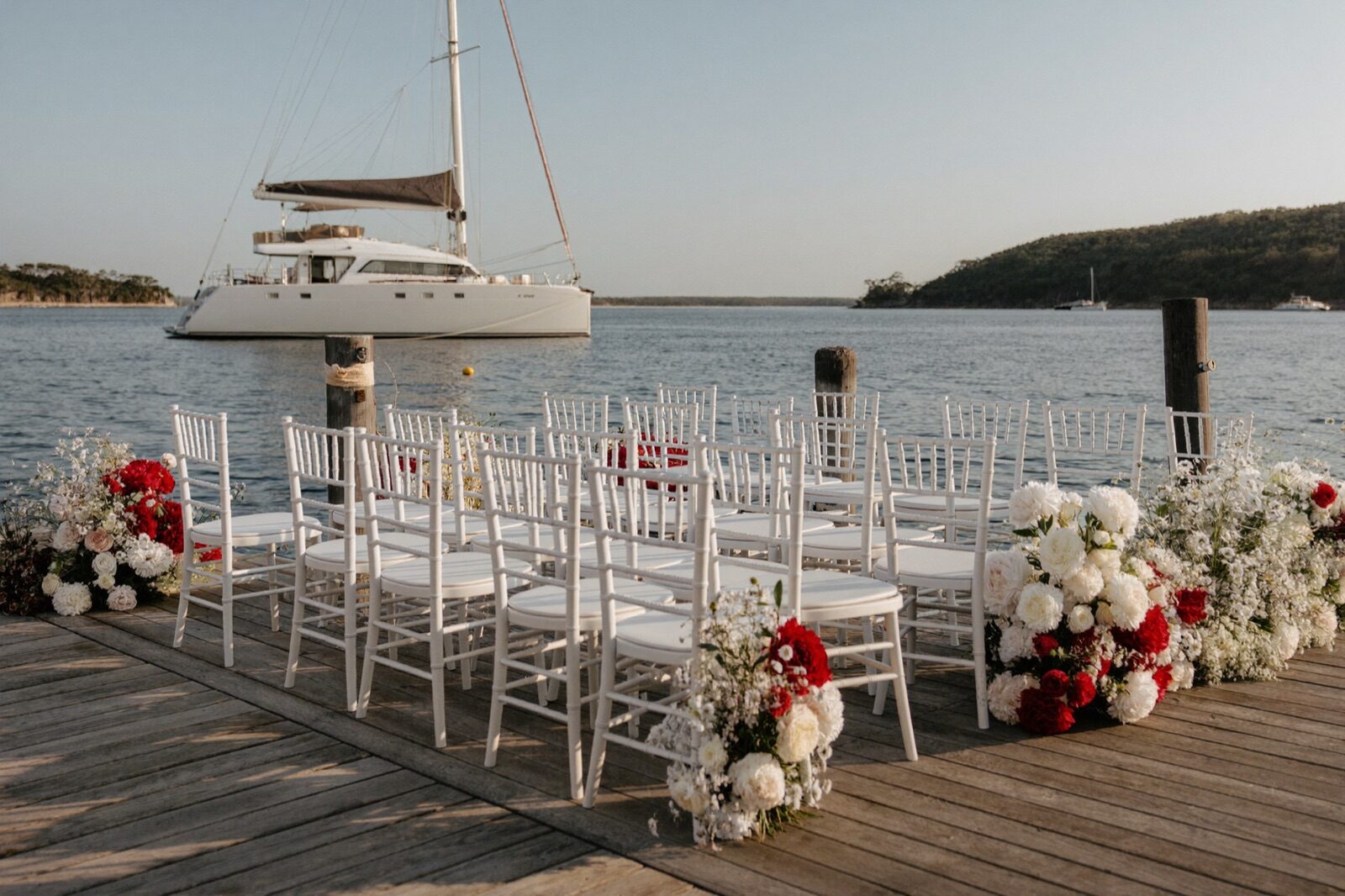 A holiday-season proposal at sunset beside the Carolina Moon