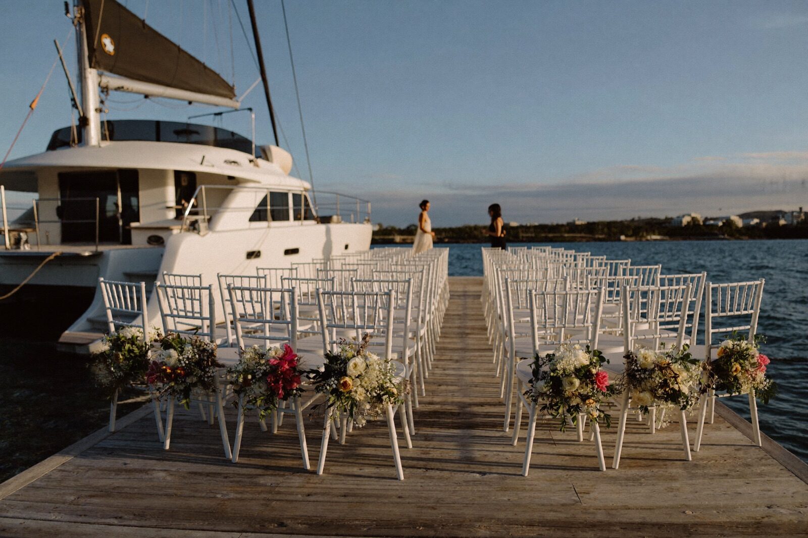 Newlyweds celebrating beside the Carolina Moon at sunset in Key Largo